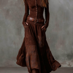 Woman wearing a suede checkered dress with belt