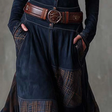 Woman wearing a suede checkered dress with belt