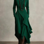 Woman wearing a draped asymmetrical maxi dress