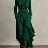 Woman wearing a draped asymmetrical maxi dress