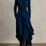 Woman wearing a draped asymmetrical maxi dress
