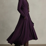 Woman wearing a draped asymmetrical maxi dress