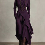 Woman wearing a draped asymmetrical maxi dress