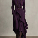 Woman wearing a draped asymmetrical maxi dress