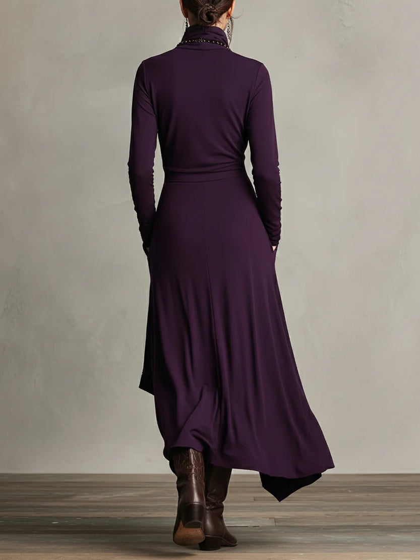 Woman wearing a draped asymmetrical maxi dress
