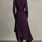 Woman wearing a draped asymmetrical maxi dress