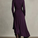 Woman wearing a draped asymmetrical maxi dress