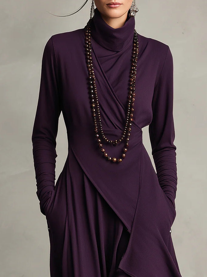 Woman wearing a draped asymmetrical maxi dress