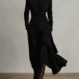 Woman wearing a draped asymmetrical maxi dress