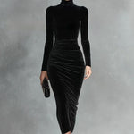 Woman wearing a black velvet fitted dress