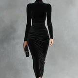 Woman wearing a black velvet fitted dress