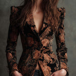 Woman wearing a black and bronze floral blazer