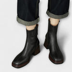 Eleanor Boots in black leather, front view on model