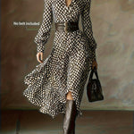 Woman wearing a rhombus print dress with belted waist