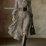 Woman wearing a rhombus print dress with belted waist