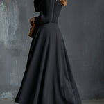 Woman wearing a vintage-inspired winter dress with pockets