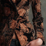 Woman wearing a black and bronze floral blazer