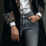 Woman wearing a long slim baroque print blazer