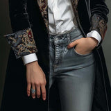 Woman wearing a long slim baroque print blazer