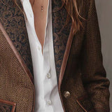 Woman wearing a herringbone panel blazer