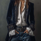Woman wearing a long embroidered velvet jacket