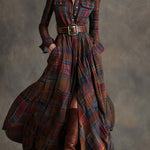 Woman wearing a belted plaid shirt dress with structured collar and flared skirt