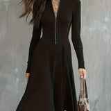 Woman wearing a zip-front long-sleeve stretch dress