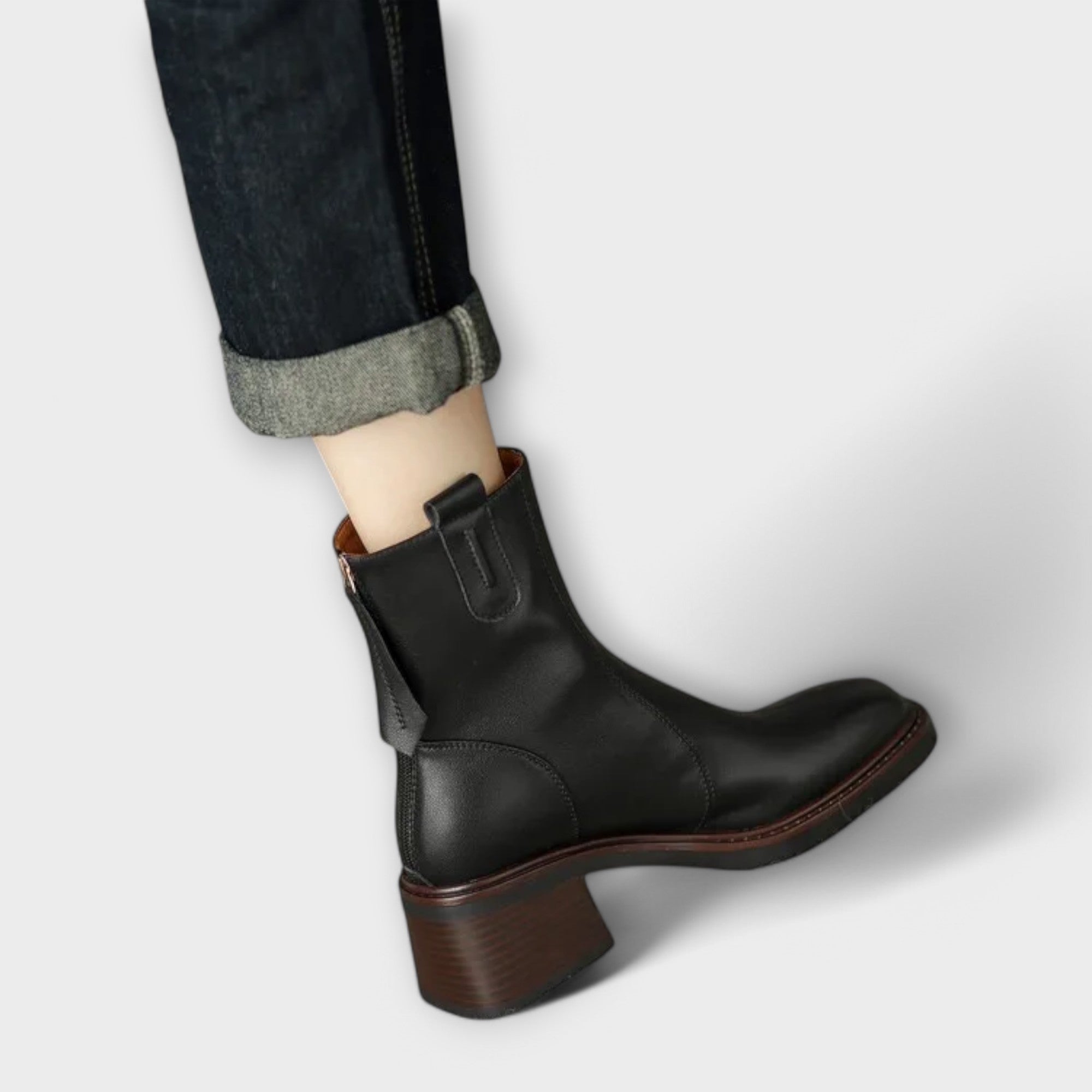 Eleanor Boots in black leather, close-up back view showing zip and heel