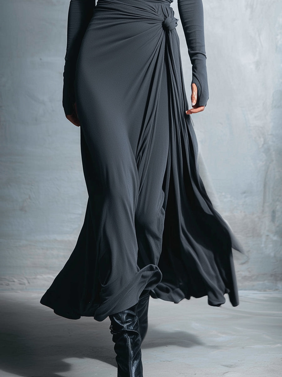 Woman wearing a long-sleeve maxi dress with an adjustable side tie