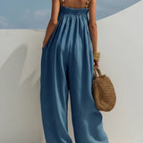 Woman wearing a wide-leg denim jumpsuit