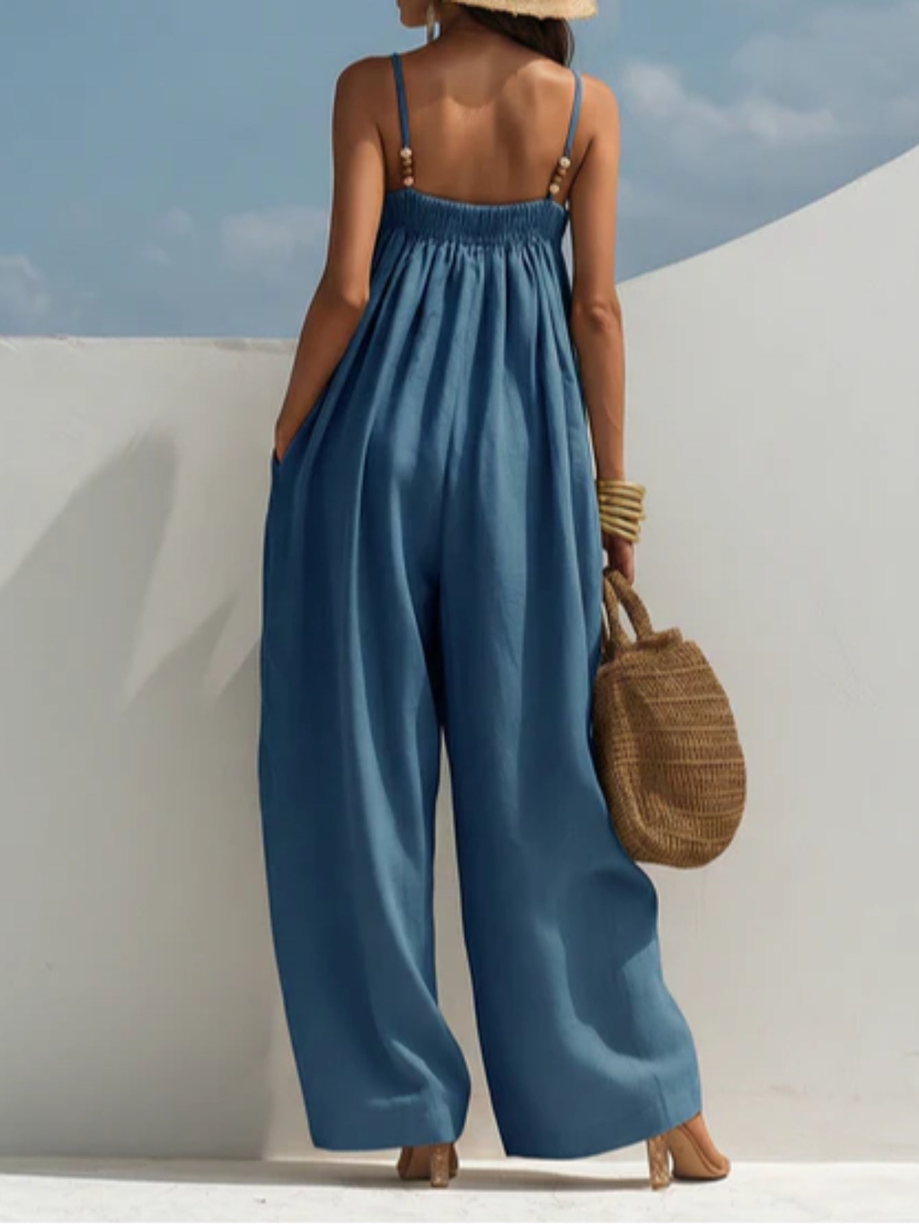Woman wearing a wide-leg denim jumpsuit