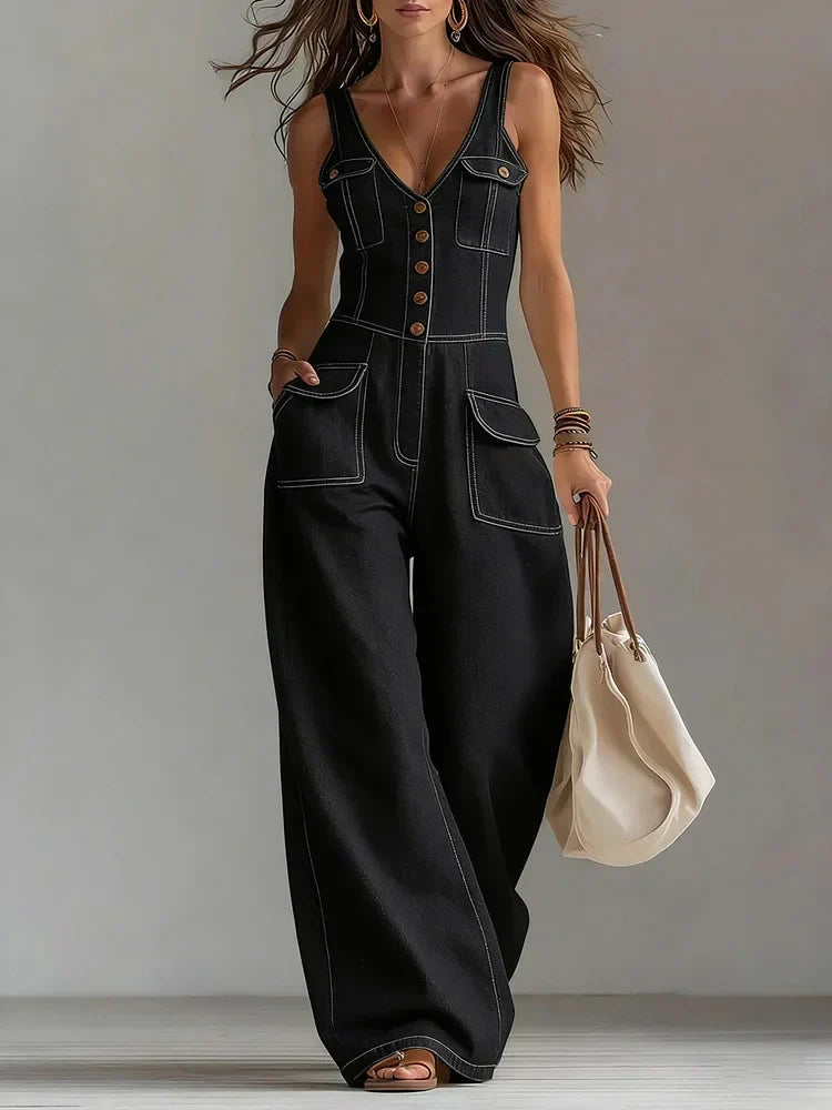 Woman wearing a relaxed-fit denim jumpsuit in a classic wash