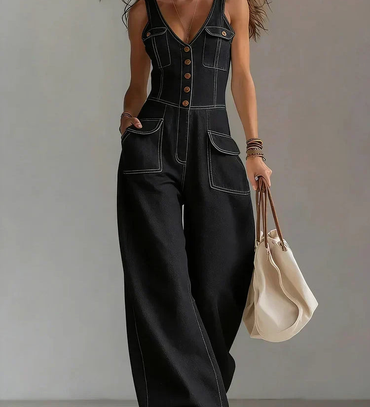 Woman wearing a relaxed-fit denim jumpsuit in a classic wash