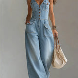 Woman wearing a relaxed-fit denim jumpsuit in a classic wash