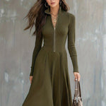 Woman wearing a zip-front long-sleeve stretch dress