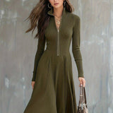 Woman wearing a zip-front long-sleeve stretch dress