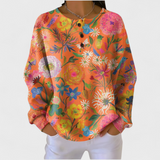 Faustine colourful floral patterned jumper in orange - front view