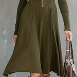 Woman wearing a zip-front long-sleeve stretch dress