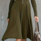 Woman wearing a zip-front long-sleeve stretch dress