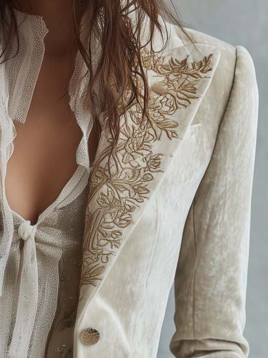 Woman wearing an ivory embroidered blazer