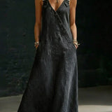 Woman wearing a long button-front denim dress