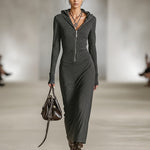 Woman wearing a long-sleeve hooded tunic dress with zip detail