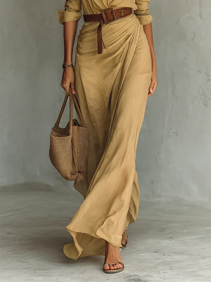 Woman wearing a wrap-style maxi dress with belt