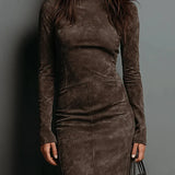 Woman wearing a suede-effect high-neck midi dress