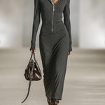 Woman wearing a long-sleeve hooded tunic dress with zip detail
