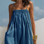 Woman wearing a wide-leg denim jumpsuit