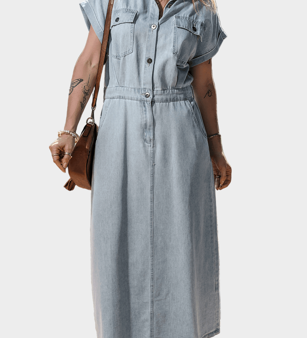 Woman wearing a long maxi denim dress with button front