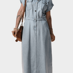 Woman wearing a long maxi denim dress with button front