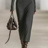 Woman wearing a long-sleeve hooded tunic dress with zip detail