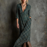 Woman wearing a full-length green plaid shirt dress with long sleeves